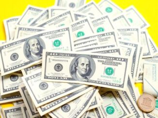 Stack of cash with bank icons.