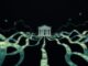 Money flowing towards a stylized Federal Reserve building.